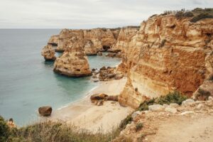 Experience the breathtaking coastal cliffs and turquoise waters - a natural masterpiece captured in serene perfection.