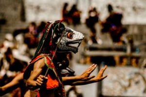 Vibrant depiction of Bhutan's traditional mask dance in a colorful festival setting in Thimphu.